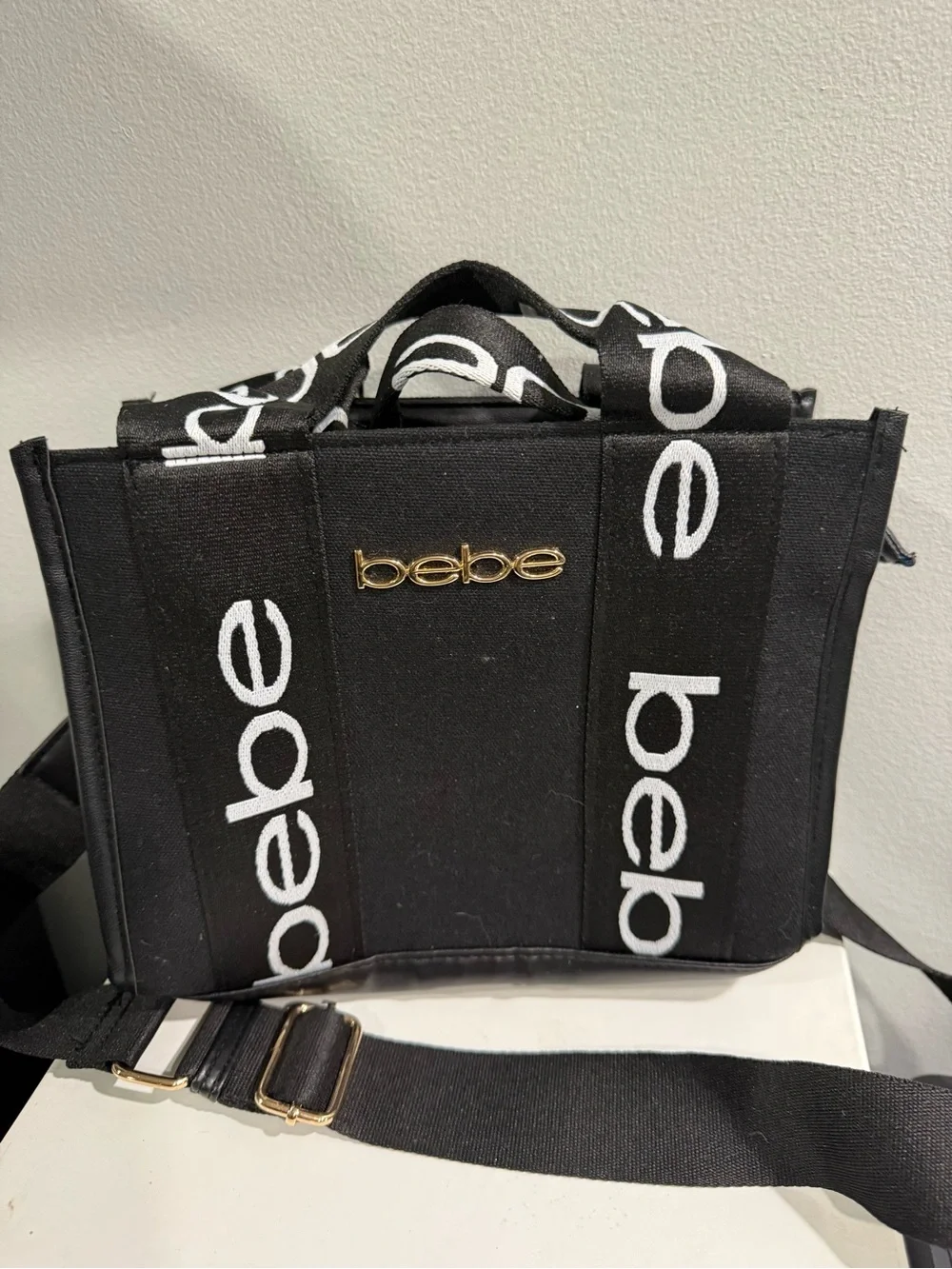 bebe Black Canvas Logo Messenger Bag with Gold Emblem